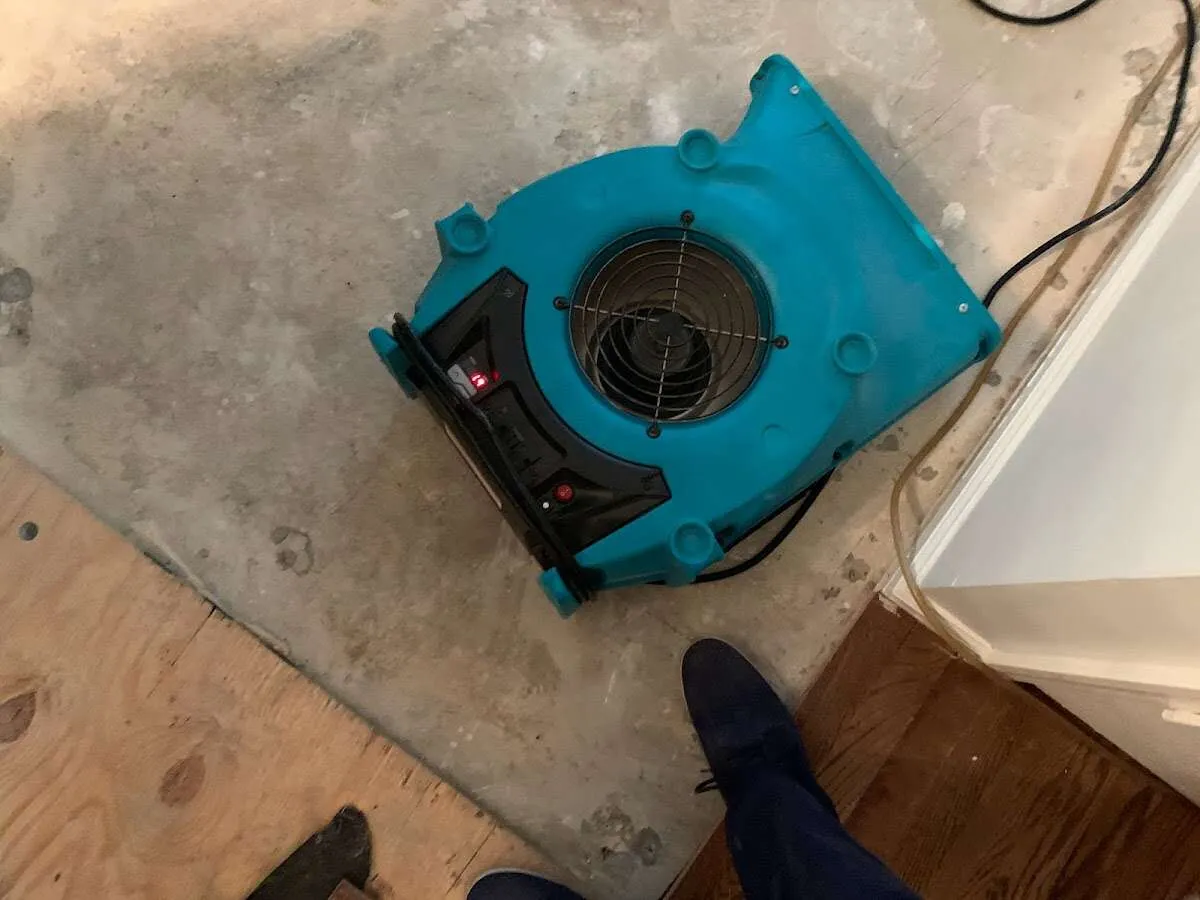 Air mover drying subfloor during Leak Detection & Repair in Frederick